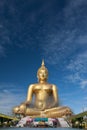 Gold buddha statue under construction in Thai temple with clear sky.WAT MUANG, Ang Thong, THAILAND. Royalty Free Stock Photo