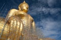Gold buddha statue under construction in Thai temple with clear sky.WAT MUANG, Ang Thong, THAILAND. Royalty Free Stock Photo