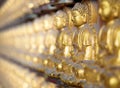 Gold buddha statue on wall