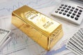 Gold bullion bar on a stocks and shares chart Royalty Free Stock Photo