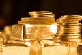 Gold bullions and stack of coins. Background for finance banking concept. Trade in precious metals.