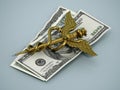 Gold caduceus symbol standing on dollar bills. 3D illustration