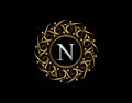 Gold Calligraphic Badge with Letter N Design. Ornamental luxury golden logo design vector illustration