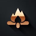 Gold Campfire icon isolated on black background. Burning bonfire with wood. Long shadow style. Vector