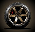 gold car wheels with racing tires