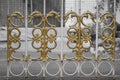 gold carved iron fence