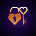 Gold Castle in the shape of a heart and key in heart shape icon isolated on black background. Love symbol and keyhole Royalty Free Stock Photo