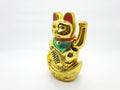 Gold Cat Statue representing luck symbol and sign for traditional chinese culture presented in white isolated background 01 Royalty Free Stock Photo