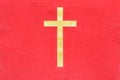 Gold catholic cross on red cloth texture background Royalty Free Stock Photo