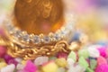 Gold chain diamonds on blurry pebbled background Royalty Free Stock Photo