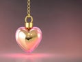 A gold chain is hung with a perfume bottle in the shape of a heart. Royalty Free Stock Photo