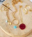 Gold chain necklaces with turquoise stones - red stone - gold shell necklace - greek jewelry Royalty Free Stock Photo