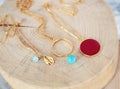 Gold chain necklaces with turquoise stones - red stone - gold shell necklace - greek jewelry Royalty Free Stock Photo