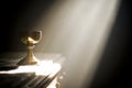 Gold chalice in altar with a ray of divine light Royalty Free Stock Photo