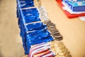 Gold champion trophies and medals lined up in rows Royalty Free Stock Photo