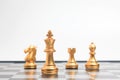 Gold Chess on chess board game for business metaphor leadership