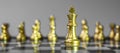 Gold Chess figure team King, Queen, Bishop, Knight, Rook and Pawn on Chessboard against opponent during battle. Strategy,