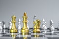 Gold Chess King, Queen and Knight horse figure on Chessboard against opponent or enemy. Strategy, Conflict, management, business Royalty Free Stock Photo