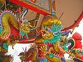 Gold china dragon statue on the arched entrance