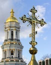 Gold Christian cross on a background of blue sky Royalty Free Stock Photo