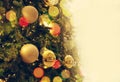 Gold Christmas background of de-focused lights with decorated tree Royalty Free Stock Photo