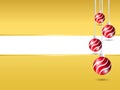 Gold Christmas background. Four hanging red shiny Christmas ball decoration at right with white blank space for your greeting text Royalty Free Stock Photo