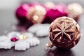 Gold christmas ball on bokeh background of xmas ornaments. Royalty Free Stock Photo