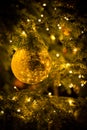 Gold christmas balls with christmas tree Royalty Free Stock Photo