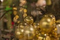 Golden christmas balls hanging in a tree Royalty Free Stock Photo