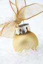 Gold Christmas bauble decoration with ribbon. Royalty Free Stock Photo