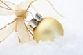 Gold Christmas bauble decoration with ribbon. Royalty Free Stock Photo