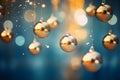 gold christmas baubles hanging from strings on a blue background Royalty Free Stock Photo