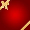 Gold Christmas bow on red card Royalty Free Stock Photo