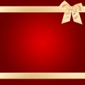 Gold Christmas bow on red card Royalty Free Stock Photo