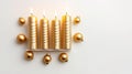 Gold Christmas Candles With Baubles On White Background