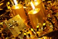 Gold christmas candles and gold gift boxes