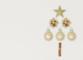 Gold Christmas decorations in the shape of a tree. Top view flat lay with copy space Royalty Free Stock Photo