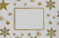 Gold Christmas frame on white background with golden christmas decorations snowflakes, balls on white background. Flat Royalty Free Stock Photo