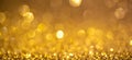 Gold Christmas lights background, banner design. Shiny glowing surface with bokeh, abstract defocused glitter with Royalty Free Stock Photo