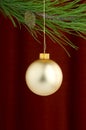 Gold Christmas ornaments on burgundy background Royalty Free Stock Photo