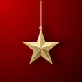 Gold Christmas star hanging on a gold chain on a festive dark background