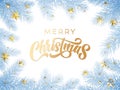Gold Christmas text greeting card on white snow background with blue frost Christmas tree branches. Golden Xmas decoration