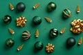 Gold Christmas tree decoration and baubles on green background. Flat lay, top view. Merry Christmas card Royalty Free Stock Photo