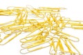 Gold clip for documents scattered on a white background isolated Royalty Free Stock Photo