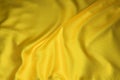 A gold cloth background with creases
