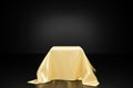 Gold cloth pedestal podium on black background, showcase product or cosmetics promotion Royalty Free Stock Photo