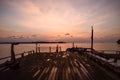 gold clouds over wooden bridge at koh mak , trat , thailand