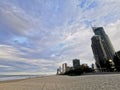 GOLD COAST, AUSTRALIA - AUGUST 15, 2020: Gold Coast Surfer Paradise open beach with blue sky and high-rise skyscrapers hotels.