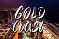 Gold Coast hand lettering over Surfers Paradise city skyline at night in Queensland, Australia. Royalty Free Stock Photo