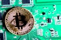 Gold coin bitcoin green electric circuit Board computer processor Royalty Free Stock Photo